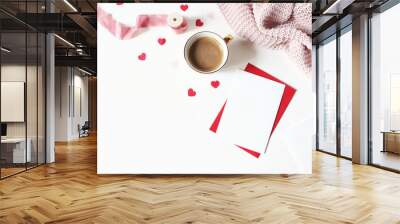 Valentines day or wedding still life scene. Cup of coffee, envelope, paper hearts confetti, knitted plaid and blank greeting card mockup on white table background. Love concept. Flat lay, top view. Wall mural