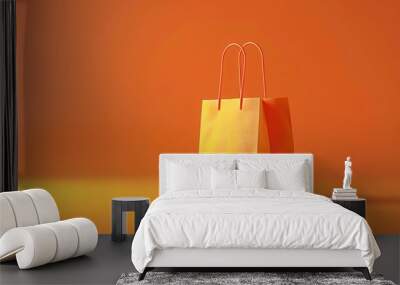 Minimalistic shot of an orange shopping bag against an orange background. Perfect for retail, shopping, and e-commerce themes. Wall mural