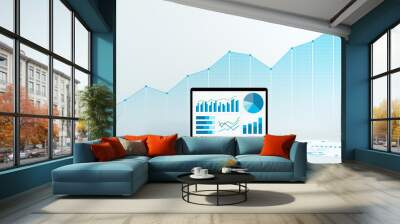 Analyzing business data and growth. Laptop and reports. Blue graphs and charts on laptop screen. Wall mural