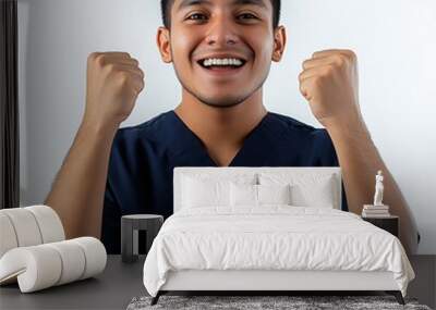 Cheerful young male healthcare professional celebrating success. Wall mural