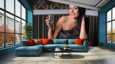 Brunette with glass of champagne Wall mural