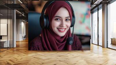 Smiling young female in a headset, exuding professionalism and warmth. Wall mural