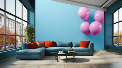 Magenta balloons against a soft blue backdrop, aerial shot with ample copy space for text. Wall mural