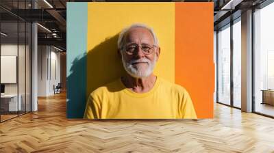 Vibrant senior smiles against a colorful backdrop.  Joyful expression, happy retirement! Wall mural