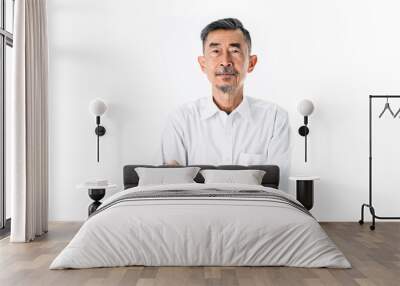 An old Asian man wearing a white shirt is happy and proud. He has Crossed his arms with two hands. Studio shot over white background. Elderly and Happy Positive single senior retired Concept Wall mural