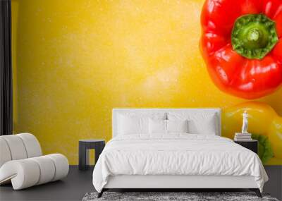 Two red and yellow bell pepper on the yellow background, colorful vegetable, isolate on the white Wall mural