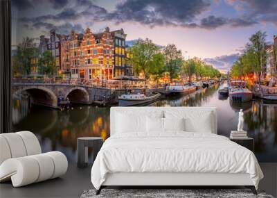 Amsterdam. Panoramic view of the downtown of Amsterdam.  A blue evening time and the serene reflection of lights in the water. Europe, Netherlands, Holland, Amsterdam. Wall mural