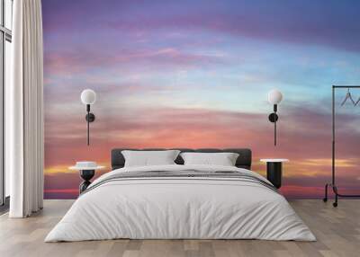 Gentle ligth colors of sunrise sundown sky with pastel  light  clouds, real sky Wall mural