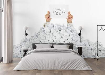 Person under crumpled pile of papers with a help sign / isolated Wall mural