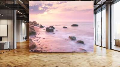 Sunrise landscape over beautiful rocky coastline in the Sea Wall mural