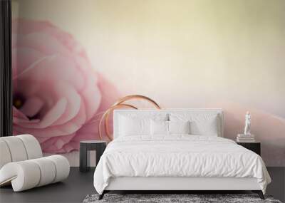 Wedding  Background with gold Rings and beautiful Eustoma rose f Wall mural