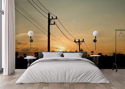 an old Power pole with line on Silhouette environment, High level of noise. sun rise or sun set time Wall mural