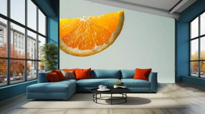 Juicy orange slices soaring in the air against a gray background Wall mural