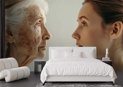 The concept of age, young and old woman as youth and old age Wall mural