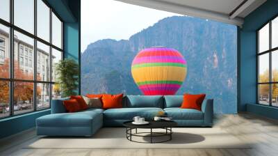 Multi-coloured hot air balloon and the Big  mountain backgroun Wall mural