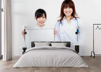 two asian beautiful doctor with blank whiteboard Wall mural