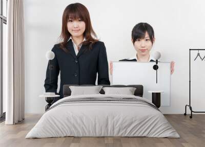 two asian businesswomen with blank whiteboard Wall mural