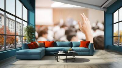  businessman raising hand during seminar. Businessman Raising Hand Up at a Conference to answer a question. Wall mural