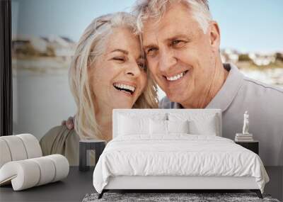 Beach, vacation and senior couple with love, smile and retirement with romance, bonding and loving together. People, old woman and elderly man with happiness, romantic and seaside holiday with travel Wall mural