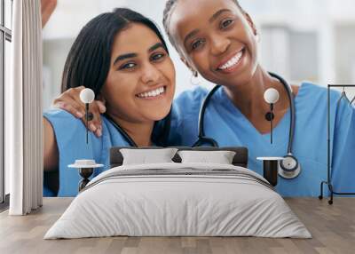 Doctors, selfie and women friends at hospital smile for photograph together with stethoscope. Happy, healthcare and interracial friendship picture of professional cardiology workers on break. Wall mural