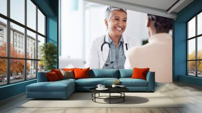 Happy, mature or doctor consulting a patient in meeting in hospital for healthcare help, feedback or support. People, medical or nurse with black woman talking or speaking of test results or advice Wall mural