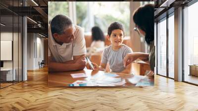 Home school, learning and parents support child with lesson and flash cards for education. Studying, kid and grandfather with teaching, communication and bonding from development and conversation Wall mural