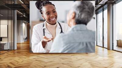 Smile, black woman or doctor consulting a patient in meeting in hospital for healthcare feedback or support. Happy, medical or nurse with a mature person talking or speaking of test results or advice Wall mural