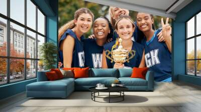 Trophy, sports and winner women team celebration portrait for international netball competition or game event with support, teamwork and achievement. Excited athlete girl group winning a prize goal Wall mural