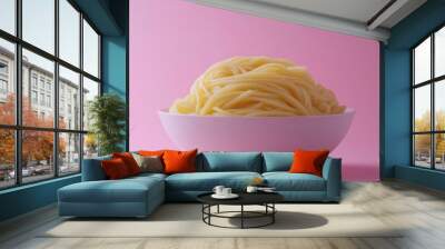 A Bowl of Cooked Spaghetti on a Pink Background Wall mural