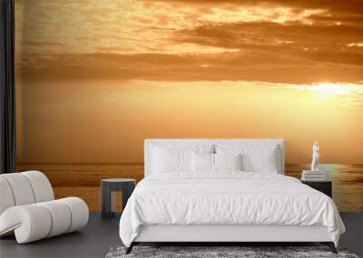 Beautiful sunrise over the sea near the coast of Sicily. Natural background orange color toned Wall mural