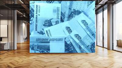 Different bills of Russian rubles close up. Money background blue color toned Wall mural