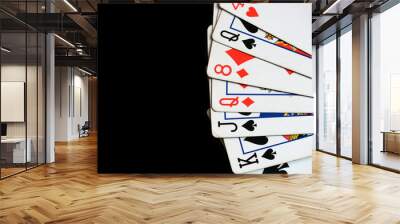 Several playing cards on a dark background close up Wall mural