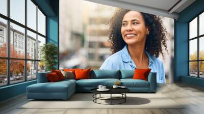 Happy, smile and face of woman in city with happiness, freedom and confidence in urban town. Thinking, relax and beautiful, confident and African female person on weekend, holiday or free time travel Wall mural