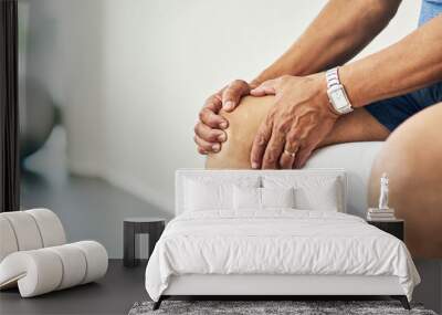 Physiotherapy, knee pain and injury with legs of man in room for consulting, medical and arthritis. Rehabilitation, muscle and joint with closeup of patient in clinic for physical therapy and healing Wall mural