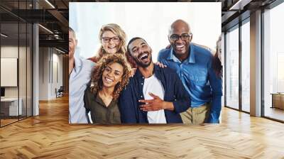 Business people, laugh portrait and hug in a office with a smile from friends teamwork and collaboration. Diversity, happiness and staff together proud from funny motivation and workforce group Wall mural