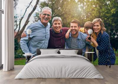 Home is where our family is. Shot of a multigenerational family outside. Wall mural