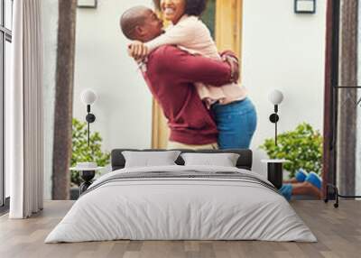 This is another big milestone for us. Shot of a young couple celebrating the move into their new house. Wall mural