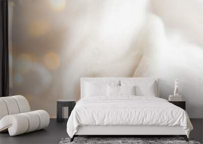 Atmospheric background with detail of a fluffy, comfortable fabric blanket and twinkling lights. Cosy winter, Christmas concept. Wall mural