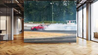 Red Drift Car / Race car drifting around corner very fast with lots of smoke from burning tires on speedway / racetrack / drift track. Infiniti g35 v8. JDM car. Luxury red sport car.	 Wall mural