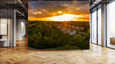 Aerial panorama of a modern row of newly constructed two story single family homes in a new construction middle class neighborhood street in the USA - American real estate with dramatic sunset sky Wall mural