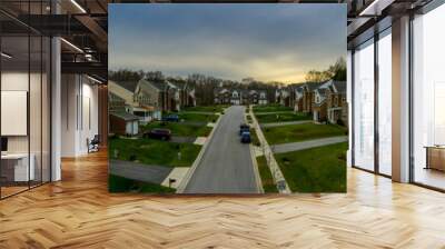 Aerial panorama of a row of newly constructed two story single family homes in a new construction middle class neighborhood street in the USA - American real estate Wall mural