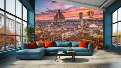 Aerial view of Firenze Florence downtown with colorful medieval houses, the magnificent cathedral, colorful sunset sky with hot air balloon flying by Wall mural