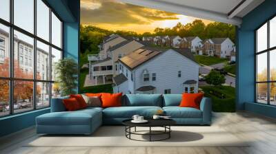 American luxury real estate single family houses with brick facade, solar power roof  and two car garages in a new construction Maryland street neighborhood USA aerial view during sunset Wall mural