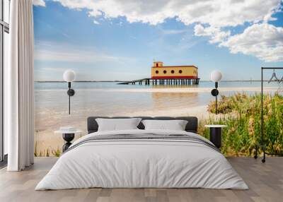 Sunny beach view of the historical life-guard building in Fuseta, Ria Formosa Natural park, Portugal Wall mural