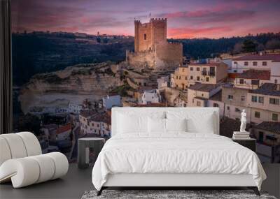 Sunset aerial panorama view of Alcala del Jucar medieval historic village with white washed houses and a castle on a rock in Albacete Spain Wall mural