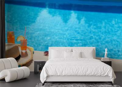 Summer holiday accessories by the swimming pool. Wall mural