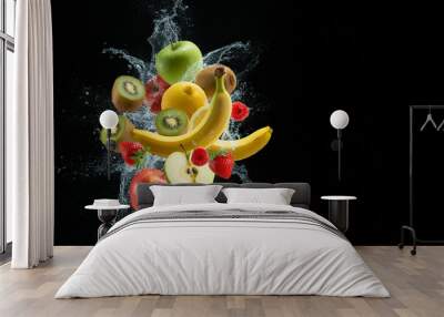 Vibrantly colored tropical fruits with splashing water on a black background. Wall mural