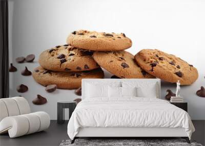 a pile of delicious chocolate chip cookies on a white background with some chocolate chips scattered around them Wall mural