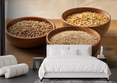 the cereal is a mixture of wheat oats and other grains a wooden table is displayed with three wooden bowls filled with an assortment of grains and seeds whole grains month Wall mural