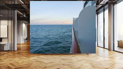 Dream holiday or vacation onboard modern luxury cruiseship or cruise ship liner with ocean views and sea panorama during blue hour or twilight Wall mural